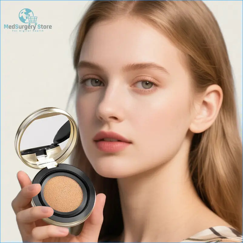 A sleek, round cushion compact with a gold-toned metallic lid and black base, featuring a beige pressed powder inside