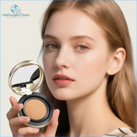 A sleek, round cushion compact with a gold-toned metallic lid and black base, featuring a beige pressed powder inside